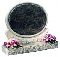 A circular Himalayan Blue granite memorial, with various finishes being used.