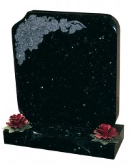 An Emerald Pearl granite memorial with a carved rose motif and base feature.