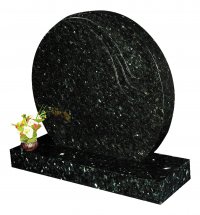 A round Emerald Pearl granite memorial.