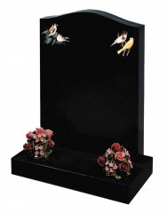 A standard Black granite ogee shaped top memorial, with a bird decoration.